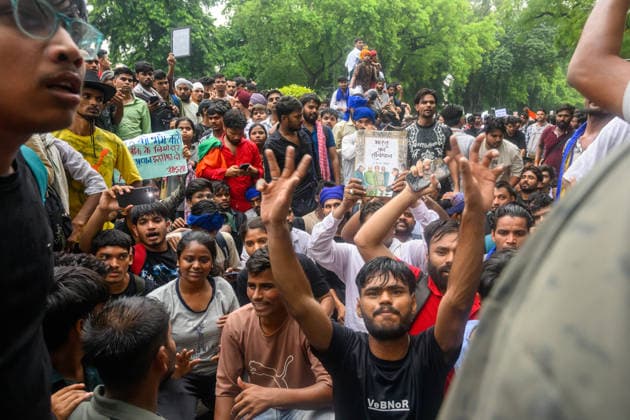 July 20, 2026, New Delhi, New Delhi, India: NEW DELHI, India Ã¢â‚¬ Protesters, one holding a copy of India s Constitution, raise their hands and shout slogans at Jantar Mantar during demonstrations by the Cockroach Janata Party (CJP) demanding the resignation of Education Minister Dharmendra Pradhan over alleged irregularities in the NEET-UG exam, July 20, 2026. New Delhi India - ZUMAm184 20260720_zip_m184_036 Copyright: xAnkitxRoyxMajumderx