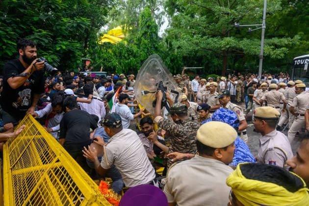 July 20, 2026, New Delhi, New Delhi, India: NEW DELHI, India Ã¢â‚¬ Protesters and police scuffle at a barricade, with an officer holding up a riot shield, at Jantar Mantar during demonstrations by the Cockroach Janata Party (CJP) demanding the resignation of Education Minister Dharmendra Pradhan over alleged irregularities in the NEET-UG exam, July 20, 2026. New Delhi India - ZUMAm184 20260720_zip_m184_043 Copyright: xAnkitxRoyxMajumderx