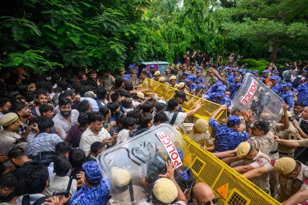 July 20, 2026, New Delhi, New Delhi, India: NEW DELHI, India Ã¢â‚¬ Police and Rapid Action Force (RAF) personnel push a barricade against protesters with riot shields raised, during demonstrations by the Cockroach Janata Party (CJP) demanding the resignation of Education Minister Dharmendra Pradhan over alleged irregularities in the NEET-UG exam, July 20, 2026. New Delhi India  - ZUMAm184 20260720_zip_m184_090 Copyright: xAnkitxRoyxMajumderx