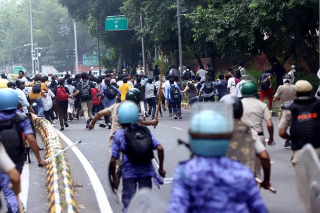 July 20, 2026, New Delhi, New Delhi, India: JULY 20, 2026, NEW DELHI, INDIA: Security personnel and Delhi Police officers in riot helmets give chase to fleeing student activists and CJP supporters along during a protest march demanding the resignation of Union Education Minister Dharmendra Pradhan over alleged exam paper leaks, near Connaught Place in New Delhi, India. Photog: City: New DelhiCountry: IndiaCategory: POL INTDate: 20.07.2026ZUMA Categories: Politics; Protests; Law & Order New Delhi India - ZUMAd288 20260720_zip_d288_005 Copyright: xDeepakx