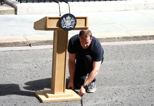 Sir Keir Starmer leaves 10 Downing Street. Tobias Gough, the No 10 Downing Street sound engineer, sets up the podium. He is known on the internet as Podium Guy. London, UK, 20 July 2026. London 10 Downing Street UK Copyright: xFredxDuvalx