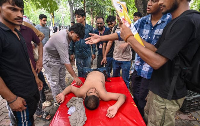 NEW DELHI, INDIA - JULY 20: An injured Cockroach Janata Party (CJP) supporter during a protest march, at Sansad Marg on July 20, 2026 in New Delhi, India. (Photo by Raj K Raj Hindustan Times) Delhi Police And Protestors Injured In Clash During Protest March