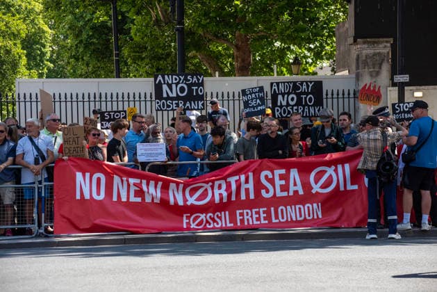 July 20, 2026, London, England, United Kingdom: Supporters of the Fossil Free London staged a demonstration outside Downing Street to demand from the new Prime Minister of the United Kingdom, Andy Burnham to say no for the Rosebank oilfield drilling on the North Sea. .The Rosebank oil field is the UKÃ¢â‚¬â ¢s largest untapped oil reserve, located roughly 130 km west of Shetland. Operated by Adura (a joint venture between Equinor and Shell) and co-owned by Ithaca Energy. London United Kingdom - ZUMAe120 20260720_zip_e120_008 Copyright: xKrisztianxElekx
