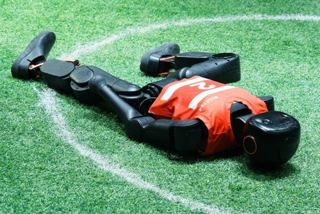 SHANGHAI, CHINA - JULY 20: A Booster Robotics Booster T2 robot falls in a 2-on-2 football match during the 2026 World Artificial Intelligence Conference on July 20, 2026 in Shanghai, China. The 2026 World AI Conference and High-Level Meeting on Global AI Governance scheduled from July 17 to July 20 showcases exhibitions of smart devices, AI plus culture and entertainment experiences, and a wide range of cutting-edge AI products, among which a range of humanoid robots and AI-powered dexterous hands as one of the highlights.  Copyright: xVCGx 111655541747