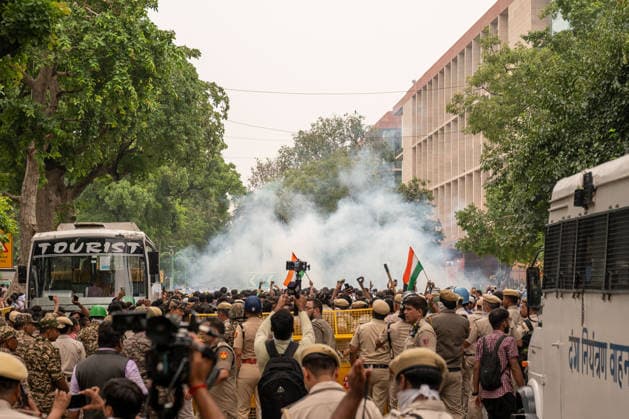 July 20, 2026, New Delhi, Delhi, India: Police fire tear gas towards protesters during a demonstration organized by the Cockroach Janta Party (CJP) marching towards Parliament. The protesters had been staging a sit-in at the protest site for nearly 30 days before announcing a march toward the Indian Parliament. They demanded the resignation of Union Education Minister Dharmendra Pradhan over alleged examination irregularities and called for the release of activist Sonam Wangchuk who was taken into custody and hospitalized following a prolonged hunger strike. New Delhi India - ZUMAs197 20260720_aaa_s197_240 Copyright: xPradeepxGaurx
