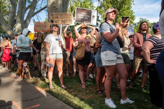 July 20, 2026, Salt Lake City, Utah, USA: Demonstrators hold signs during a protest outside the Utah Governor s Mansion in Salt Lake City, Utah, on Monday, July 20, 2026. The community rally was organized to protest executive actions drastically reducing the boundaries of the Bears Ears and Grand Staircase-Escalante national monuments. Salt Lake City USA  - ZUMAm292 20260720_znp_m292_011 Copyright: xCharlesxMcClintockxWilsonx