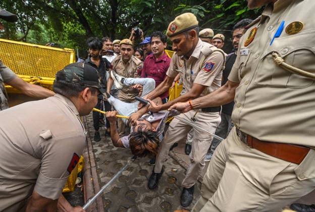 NEW DELHI, INDIA - JULY 20: Delhi Police personnel detain supporters of the CJP during a protest march near Parliament House on July 20, 2026 in New Delhi, India. (Photo by Raj K Raj Hindustan Times) Delhi Police Detain Protestors During CJP March Towards Parliament