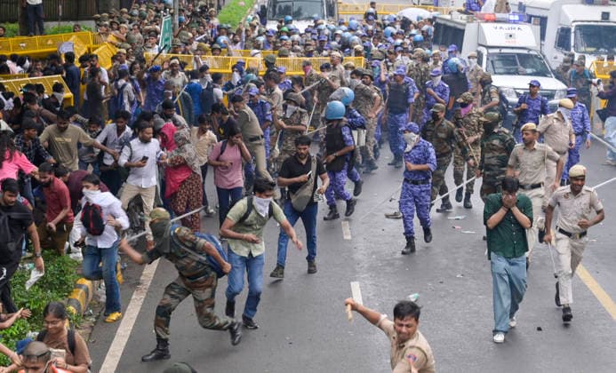 NEW DELHI, INDIA - JULY 20: Security personnel Lathi charge on protesters during the CJP protest march towards Parliament demanding resignation of Union Education Minister Dharmendra Pradhan over NEET Paper leak near the Parliament House on July 20, 2026 in New Delhi, India. (Photo by Raj K Raj Hindustan Times) Delhi Police Use Lathi Charge And Tear Gas Shells To Disperse CJP Supporters During Their March To Parliament
