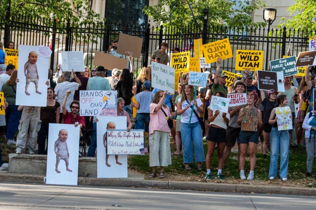July 20, 2026, Salt Lake City, Utah, USA: Demonstrators hold signs during a protest outside the Utah Governor s Mansion in Salt Lake City, Utah, on Monday, July 20, 2026. The community rally was organized to protest executive actions drastically reducing the boundaries of the Bears Ears and Grand Staircase-Escalante national monuments. Salt Lake City USA  - ZUMAm292 20260720_znp_m292_020 Copyright: xCharlesxMcClintockxWilsonx