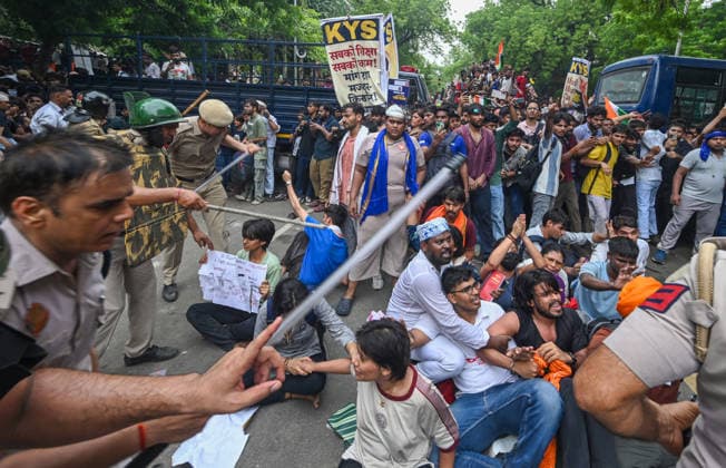 NEW DELHI, INDIA - JULY 20: Security personnel carry out Lathi charge during CJP protest March to near the Parliament House on July 20, 2026 in New Delhi, India. (Photo by Raj K Raj Hindustan Times) Delhi Police Use Lathi Charge And Tear Gas Shells To Disperse CJP Supporters During Their March To Parliament