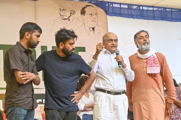 NEW DELHI, INDIA - JULY 20: Advocate Prashant Bhushan and political activist Yogendra Yadav participate in a march towards Parliament organized by the Cockroach Janta Party (CJP) from Jantar Mantar on July 20, 2026 in New Delhi, India. The leaders joined thousands of protesters and activists during the march, which was held amid heightened security arrangements and extensive barricading along the route. (Photo by Sanchit Khanna Hindustan Times) Cockroach Janata Party Protest March To Parliament