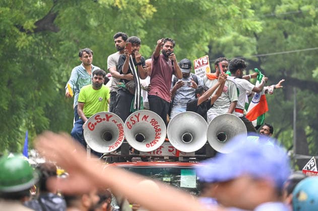 NEW DELHI, INDIA - JULY 20: Abhijeet Dipke, founder of the Cockroach Janta Party (CJP), participates in a protest march towards Parliament from Jantar Mantar on July 20, 2026 in New Delhi, India. The march, held amid heavy security arrangements, drew thousands of supporters demanding action over alleged examination paper leaks and reforms in the education system. (Photo by Sanchit Khanna Hindustan Times) Cockroach Janata Party Protest March To Parliament