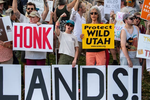 July 20, 2026, Salt Lake City, Utah, USA: Demonstrators hold signs during a protest outside the Utah Governor s Mansion in Salt Lake City, Utah, on Monday, July 20, 2026. The community rally was organized to protest executive actions drastically reducing the boundaries of the Bears Ears and Grand Staircase-Escalante national monuments. Salt Lake City USA  - ZUMAm292 20260720_znp_m292_037 Copyright: xCharlesxMcClintockxWilsonx