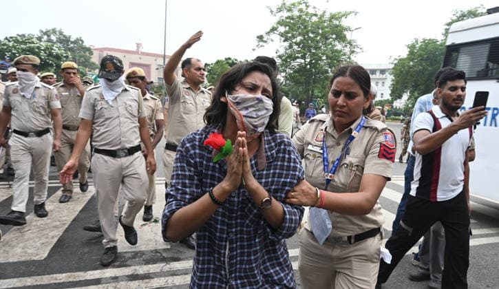 NEW DELHI, INDIA - JULY 20: Police personnel lathi Charged and useing Tear Gas on protesters during the protest march against alleged NEET paper leak at Out side Parliament House raisina Hill Road on July 20, 2026 in New Delhi, India. (Photo by Sonu Mehta Hindustan Times) Delhi Police Use Lathi Charge And Tear Gas Shells To Disperse CJP Supporters During Their March To Parliament