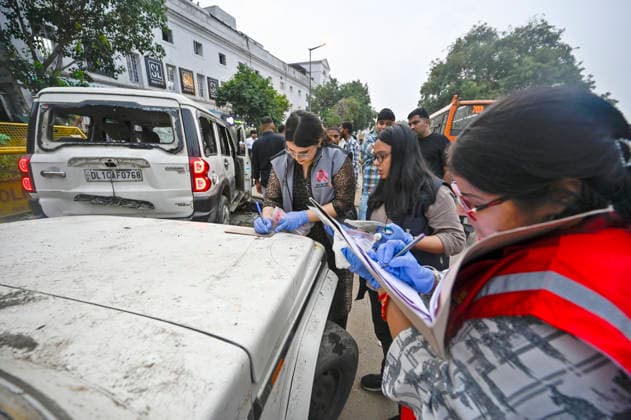 NEW DELHI, INDIA - JULY 20: Delhi Police forensic team members inspect government vehicles vandalised by a mob following the Cockroach Janata Party (CJP) protest at the Outer Circle near Regal Cinema in Connaught Place on July 20, 2026 in New Delhi, India. (Photo by Sanjeev Verma Hindustan Times) Delhi Police Forensic Team Inspects Government Vehicles Vandalised During Cockroach Janata Party Protest March
