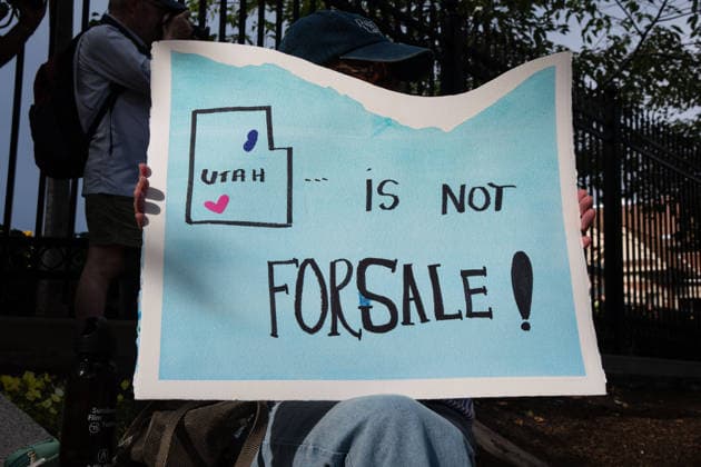July 20, 2026, Salt Lake City, Utah, USA: A protester holds a sign reading Utah is not for sale! outside the Utah Governor s Mansion in Salt Lake City, Utah, on Monday, July 20, 2026. The community rally was organized to protest executive actions drastically reducing the boundaries of the Bears Ears and Grand Staircase-Escalante national monuments. Salt Lake City USA  - ZUMAm292 20260720_znp_m292_050 Copyright: xCharlesxMcClintockxWilsonx