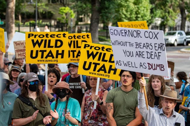 July 20, 2026, Salt Lake City, Utah, USA: Demonstrators hold signs during a protest outside the Utah Governor s Mansion in Salt Lake City, Utah, on Monday, July 20, 2026. The community rally was organized to protest executive actions drastically reducing the boundaries of the Bears Ears and Grand Staircase-Escalante national monuments. Salt Lake City USA  - ZUMAm292 20260720_znp_m292_056 Copyright: xCharlesxMcClintockxWilsonx
