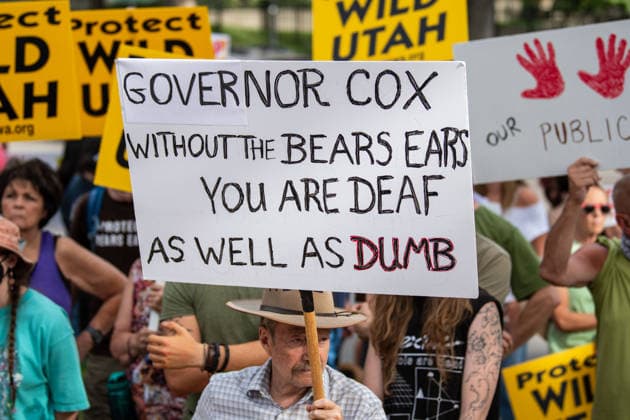 July 20, 2026, Salt Lake City, Utah, USA: Demonstrators hold signs during a protest outside the Utah Governor s Mansion in Salt Lake City, Utah, on Monday, July 20, 2026. The community rally was organized to protest executive actions drastically reducing the boundaries of the Bears Ears and Grand Staircase-Escalante national monuments. Salt Lake City USA  - ZUMAm292 20260720_znp_m292_059 Copyright: xCharlesxMcClintockxWilsonx
