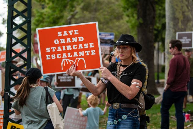 July 20, 2026, Salt Lake City, Utah, USA: A protester wearing a cowboy hat holds an orange sign reading SAVE GRAND STAIRCASE ESCALANTE during a rally outside the Utah Governor s Mansion in Salt Lake City, Utah, on Monday, July 20, 2026. The community demonstration was organized to protest executive actions drastically reducing the boundaries of the Bears Ears and Grand Staircase-Escalante national monuments. Salt Lake City USA  - ZUMAm292 20260720_znp_m292_079 Copyright: xCharlesxMcClintockxWilsonx