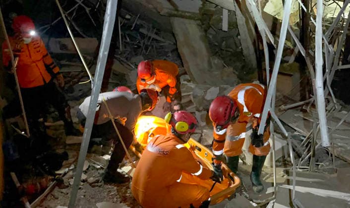 (260721) -- MEDAN, July 21, 2026 -- This photo provided by Indonesia s National Search and Rescue Agency (Basarnas) Medan shows rescuers working at the scene after a powerful explosion in a residential complex in Medan, North Sumatra, Indonesia, July 21, 2026. A powerful explosion tore through a three-story house in a residential complex in the western Indonesian city of Medan on Monday evening, killing three people and causing extensive damage to surrounding properties, authorities said Tuesday. ( Handout via Xinhua) (SpotNews) INDONESIA-MEDAN-RESIDENTIAL COMPLEX-EXPLOSION-AFTERMATH BasarnasxMedan 