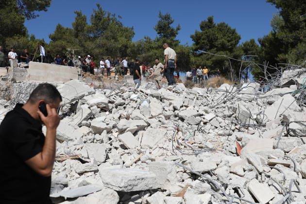 Israeli forces demolish Palestinian home east of Hebron Israeli bulldozers demolish a two-story house belonging to Fouad Jaradat in the Wadi al-Sharakh area of Sa ir, east of Hebron in the occupied West Bank, as Israeli forces deploy in the area and Palestinians inspect the site, on July 21, 2026. Israeli authorities said the house was built without a permit. Photo by Mamoun Wazwaz Hebron West Bank Palestinian Territory 210726_Hebron_MW_00(14) Copyright: xapaimagesxMamounxWazwazx xapaimagesx