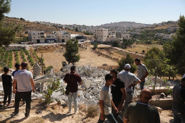 Israeli forces demolish Palestinian home east of Hebron Israeli bulldozers demolish a two-story house belonging to Fouad Jaradat in the Wadi al-Sharakh area of Sa ir, east of Hebron in the occupied West Bank, as Israeli forces deploy in the area and Palestinians inspect the site, on July 21, 2026. Israeli authorities said the house was built without a permit. Photo by Mamoun Wazwaz Hebron West Bank Palestinian Territory 210726_Hebron_MW_00(15) Copyright: xapaimagesxMamounxWazwazx xapaimagesx