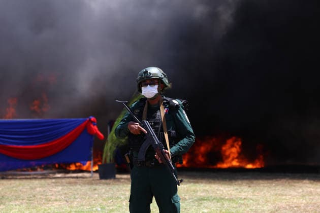 (260721) -- KANDAL, July 21, 2026 -- An anti-drug police officer stands guard during a drug-burning ceremony in Kandal province, Cambodia, July 21, 2026. Cambodia destroyed 5.62 tons of illicit drugs and precursor chemicals valued at 500 million U.S. dollars on Tuesday, Deputy Prime Minister and Interior Minister Sar Sokha said. (Photo by Sovannara Xinhua) CAMBODIA-KANDAL-DRUG-BURNING CEREMONY WuxChangwei 