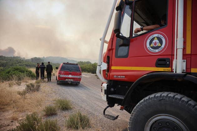 Firefighters battle forest fires in Bouira, Algeria BOUIRA, ALGERIA - JULY 21: Civil defense and firefighting teams battle flames spreading through a forested mountainous area in El Hachimia, Bouira province, on July 21, 2026 in Bouira, Algeria. Crews continue efforts to bring the forest fires under control and prevent the flames from spreading further. Hamza Zait Anadolu Bouira Algeria. Editorial use only. Please get in touch for any other usage.  Copyright: x2026xAnadoluxHamzaxZaitx