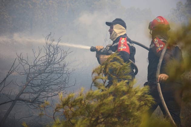 Firefighters battle forest fires in Bouira, Algeria BOUIRA, ALGERIA - JULY 21: Civil defense and firefighting teams battle flames spreading through a forested mountainous area in El Hachimia, Bouira province, on July 21, 2026 in Bouira, Algeria. Crews continue efforts to bring the forest fires under control and prevent the flames from spreading further. Hamza Zait Anadolu Bouira Algeria. Editorial use only. Please get in touch for any other usage.  Copyright: x2026xAnadoluxHamzaxZaitx