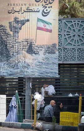 Anti‘Trump Messaging Appears On Billboards In Tehran Iranian people stand beneath a billboard depicting a symbolic image of an armed Iranian warrior aiming an anti-aircraft missile launcher from a stylized shore of the Persian Gulf, in downtown Tehran, Iran, on July 21, 2026, amid renewed conflicts between Iran and the United States in southern Iran. MORTEZA NIKOUBAZL NurPhoto Tehran Tehran Iran  Copyright: xMortezaxNikoubazlx originalFilename: nikoubazl-antitrum260721_npOoe.jpg