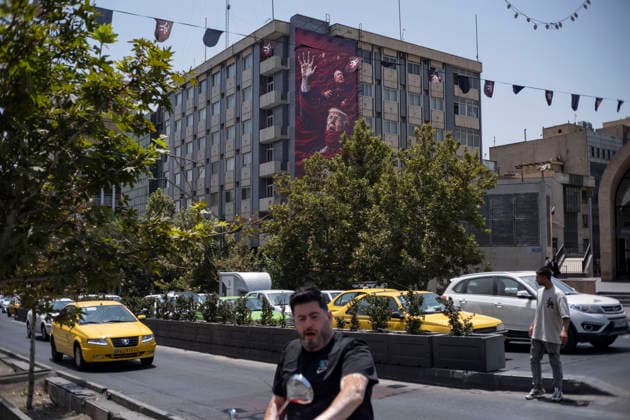 Anti‘Trump Messaging Appears On Billboards In Tehran Vehicles and a motorcycle move beneath an anti-U.S.-Israeli billboard in downtown Tehran, Iran, on July 21, 2026, amid renewed conflicts between Iran and the United States in southern Iran. MORTEZA NIKOUBAZL NurPhoto Tehran Tehran Iran  Copyright: xMortezaxNikoubazlx originalFilename: nikoubazl-antitrum260721_npqBC.jpg