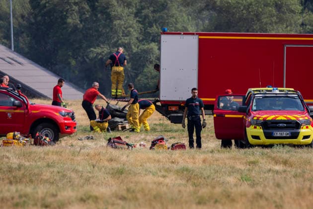 Argentiere La Bessee Wildfire - France Firefighters unload equipment from a logistics truck during wildfire operations near L Argentiere la Bessee, emergency crews prepare and organize material before deployment to the fire line as efforts continue to contain the wildfire. Hautes Alpes, France, July 21, 2026. Photo by Thibaut Durand ABACAPRESS.COM Argentiere La Besse Provence-Alpes-Cote d Azur France  Copyright: xDurandxThibaut ABACAx
