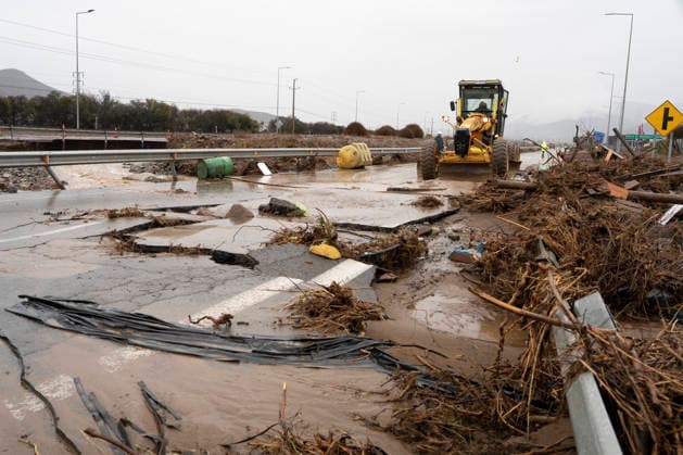 (260721) -- SANTIAGO, July 21, 2026 -- A rescue vehicle operates at a damaged part of a highway in Coquimbo region, Chile, July 19, 2026. Heavy rains have battered Chile s northern Atacama and Coquimbo regions since last week. The rainfall has killed at least ten people, prompting the declaration of a state of emergency. CHILE-COQUIMBO-FLOODS ZhuxYubo 