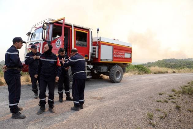Fires in the Bouira Mountains in Algeria: Civil Defense Responds to Extinguish Fires in the Bouira Mountains in Algeria on July 21, 2026. According to the Civil Defense report, the fires are under control. Photo by Billel Bensalem, APP, Bouira, Algeria Copyright: xAPPxAlgeriexPressxPhotosxBillelxBensalemx xAPPx IMG_6466