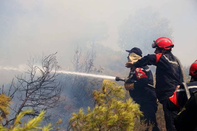 Fires in the Bouira Mountains in Algeria: Civil Defense Responds to Extinguish Fires in the Bouira Mountains in Algeria on July 21, 2026. According to the Civil Defense report, the fires are under control. Photo by Billel Bensalem, APP, Bouira, Algeria Copyright: xAPPxAlgeriexPressxPhotosxBillelxBensalemx xAPPx IMG_6491