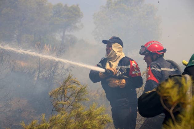 Fires in the Bouira Mountains in Algeria: Civil Defense Responds to Extinguish Fires in the Bouira Mountains in Algeria on July 21, 2026. According to the Civil Defense report, the fires are under control. Photo by Billel Bensalem, APP, Bouira, Algeria Copyright: xAPPxAlgeriexPressxPhotosxBillelxBensalemx xAPPx IMG_6496
