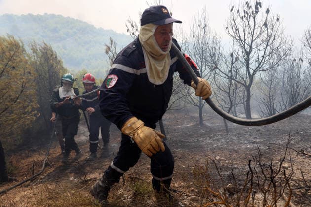 Fires in the Bouira Mountains in Algeria: Civil Defense Responds to Extinguish Fires in the Bouira Mountains in Algeria on July 21, 2026. According to the Civil Defense report, the fires are under control. Photo by Billel Bensalem, APP, Bouira, Algeria Copyright: xAPPxAlgeriexPressxPhotosxBillelxBensalemx xAPPx IMG_6529