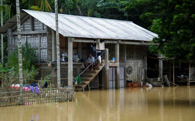 Floodwaters Submerge Areas in Assam™s Jorhat, Resident Sits Outside Inundated House Jorhat Assam , Jul 21 (ANI): A resident sits on the steps of a flood-affected house surrounded by inundated water in Teok as floodwaters submerge the surrounding area, in Jorhat on Tuesday. Jorhat Assam India Copyright: xANIx ANI_20260721394