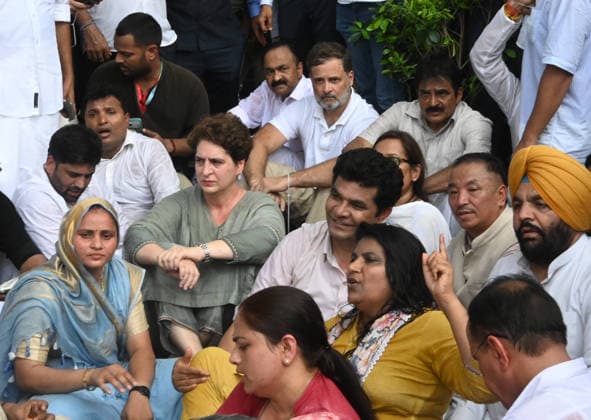 NEW DELHI, INDIA - JULY 21: Leader of Opposition in the Lok Sabha Rahul Gandhi with Priyanka Gandhi Vadra, Kerala Chief Minister VD Satheesan, Congress MP KC Venugopal, and others, stages a sit-in protest near the Prime Minister s residence in solidarity with students protesting over alleged irregularities in the NEET examination, on July 21, 2026 in New Delhi, India. The spontaneous demonstration at Lok Kalyan Marg unfolded a day after security forces used tear gas and lathi charges to disperse student marchers led by the Cockroach Janata Party (CJP) near Parliament Street. Rahul Gandhi demanded the immediate resignation of Union Education Minister Dharmendra Pradhan and an urgent, dedicated debate in Parliament regarding the NEET paper l