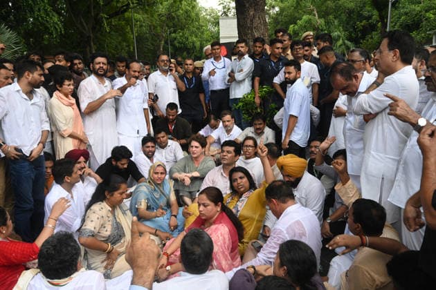 NEW DELHI, INDIA - JULY 21: Leader of Opposition in the Lok Sabha Rahul Gandhi with Priyanka Gandhi Vadra, Kerala Chief Minister VD Satheesan, Congress MP KC Venugopal, and others, stages a sit-in protest near the Prime Minister s residence in solidarity with students protesting over alleged irregularities in the NEET examination, on July 21, 2026 in New Delhi, India. The spontaneous demonstration at Lok Kalyan Marg unfolded a day after security forces used tear gas and lathi charges to disperse student marchers led by the Cockroach Janata Party (CJP) near Parliament Street. Rahul Gandhi demanded the immediate resignation of Union Education Minister Dharmendra Pradhan and an urgent, dedicated debate in Parliament regarding the NEET paper l