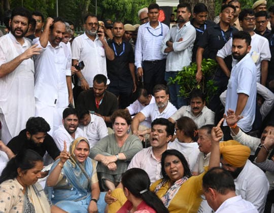 NEW DELHI, INDIA - JULY 21: Leader of Opposition in the Lok Sabha Rahul Gandhi with Priyanka Gandhi Vadra, Kerala Chief Minister VD Satheesan, Congress MP KC Venugopal, and others, stages a sit-in protest near the Prime Minister s residence in solidarity with students protesting over alleged irregularities in the NEET examination, on July 21, 2026 in New Delhi, India. The spontaneous demonstration at Lok Kalyan Marg unfolded a day after security forces used tear gas and lathi charges to disperse student marchers led by the Cockroach Janata Party (CJP) near Parliament Street. Rahul Gandhi demanded the immediate resignation of Union Education Minister Dharmendra Pradhan and an urgent, dedicated debate in Parliament regarding the NEET paper l