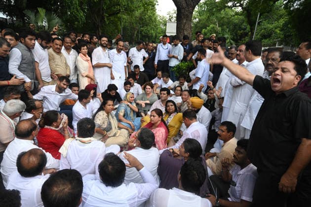 NEW DELHI, INDIA - JULY 21: Leader of Opposition in the Lok Sabha Rahul Gandhi with Priyanka Gandhi Vadra, Kerala Chief Minister VD Satheesan, Congress MP KC Venugopal, and others, stages a sit-in protest near the Prime Minister s residence in solidarity with students protesting over alleged irregularities in the NEET examination, on July 21, 2026 in New Delhi, India. The spontaneous demonstration at Lok Kalyan Marg unfolded a day after security forces used tear gas and lathi charges to disperse student marchers led by the Cockroach Janata Party (CJP) near Parliament Street. Rahul Gandhi demanded the immediate resignation of Union Education Minister Dharmendra Pradhan and an urgent, dedicated debate in Parliament regarding the NEET paper l