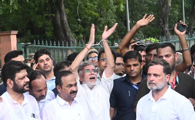 NEW DELHI, INDIA - JULY 21: Leader of Opposition in the Lok Sabha Rahul Gandhi and others, stages a sit-in protest near the Prime Minister s residence in solidarity with students protesting over alleged irregularities in the NEET examination, on July 21, 2026 in New Delhi, India. The spontaneous demonstration at Lok Kalyan Marg unfolded a day after security forces used tear gas and lathi charges to disperse student marchers led by the Cockroach Janata Party (CJP) near Parliament Street. Rahul Gandhi demanded the immediate resignation of Union Education Minister Dharmendra Pradhan and an urgent, dedicated debate in Parliament regarding the NEET paper leak controversy. (Photo by Sonu Mehta Hindustan Times) LoP Lok Sabha Rahul Gandhi Stages