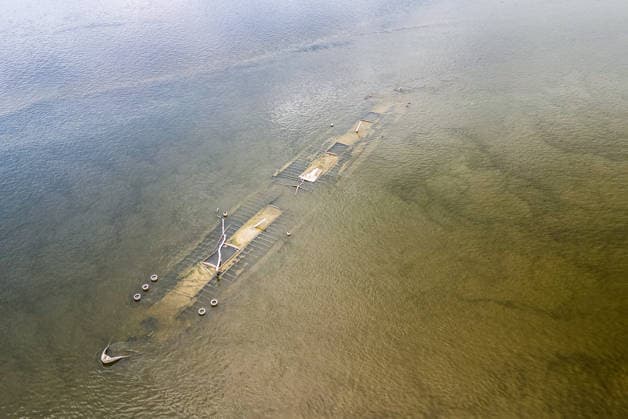 Low water reveals remains of century-old ship on Croatia s Danube An aerial view shows the remains of a ship believed to be more than a century old after record-low water levels in the Danube River exposed the wreck in Opatovac, Croatia, on July 21, 2026. The vessel is believed to have sunk between the two World Wars.  DavidxJerkovic PIXSELL