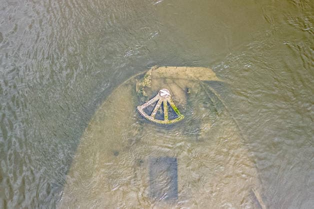 Low water reveals remains of century-old ship on Croatia s Danube An aerial view shows the remains of a ship believed to be more than a century old after record-low water levels in the Danube River exposed the wreck in Opatovac, Croatia, on July 21, 2026. The vessel is believed to have sunk between the two World Wars.  DavidxJerkovic PIXSELL