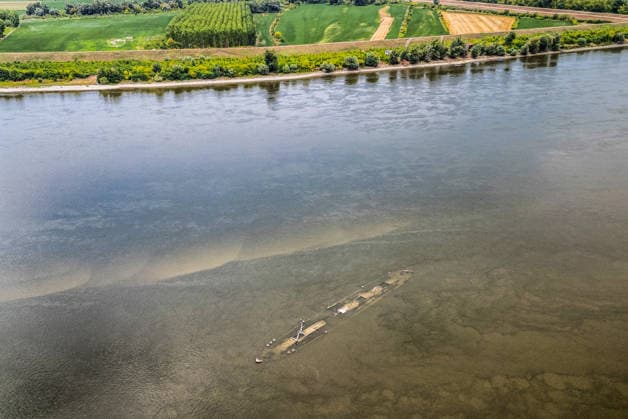 Low water reveals remains of century-old ship on Croatia s Danube An aerial view shows the remains of a ship believed to be more than a century old after record-low water levels in the Danube River exposed the wreck in Opatovac, Croatia, on July 21, 2026. The vessel is believed to have sunk between the two World Wars.  DavidxJerkovic PIXSELL
