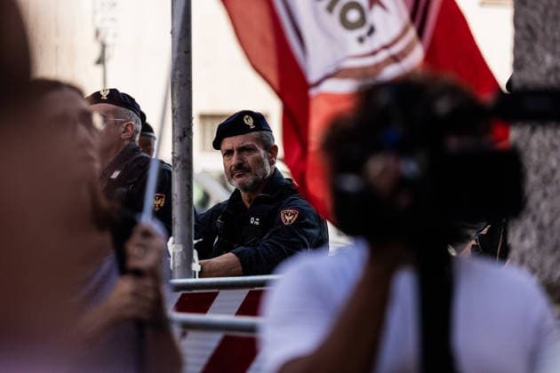 July 21, 2026, Milan, Mi, Italy: Police guard a protest was organized following the death of Abderrahim Fakir, a 42-year-old entrepreneur of Moroccan origin who died on Sunday while being pinned face-down on the ground by police officers. The demonstration in memory of Fakir, held in front of the prefecture, drew hundreds of people. Milan Italy  - ZUMAc276 20260721_zip_c276_001 Copyright: xAndreaxCarrubbax