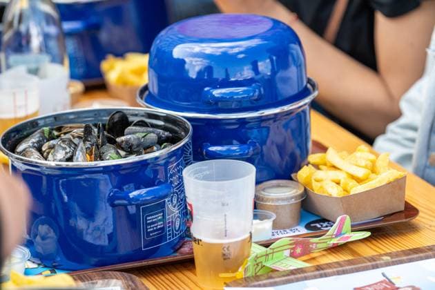 Mussels, fries and beer is served at the Everyone to the Table initiative by Resto National at Vossenplein - Place du Jeu de Balle, as part of the National Holiday, on Tuesday 21 July 2026 in Brussels.  JONASxROOSENS 181694906