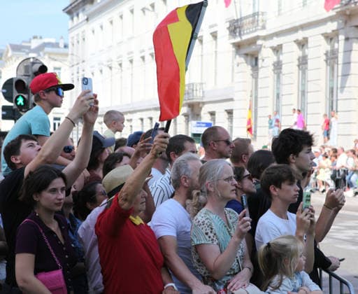 BRUSSELS, BELGIUM - JULY 21: A local resident waves Belgian national flag during Belgium s National Day on July 21, 2026 in Brussels, Belgium. The event marks the country s national holiday with a ceremonial procession in the capital.  Copyright: xChinaxNewsxServicex 111655732344