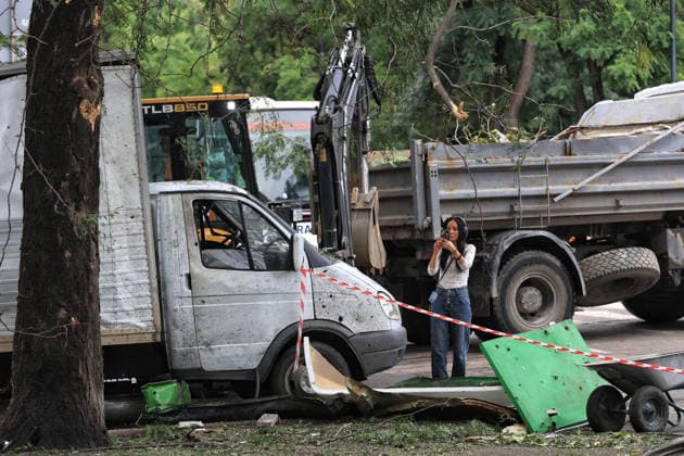 A woman captures damage caused by a Russian combined strike near a truck, Odesa, Ukraine, July 21, 2026. The Russian army carried out a missile and drone attack on the southern Ukrainian port city and the region. The attack damaged the residential building, nearby structures and cars. Three people were injured. (Photo by Nina Liashonok Ukrinform) Russians attack historical centre in Odesa  Copyright: xNinaxLiashonokx